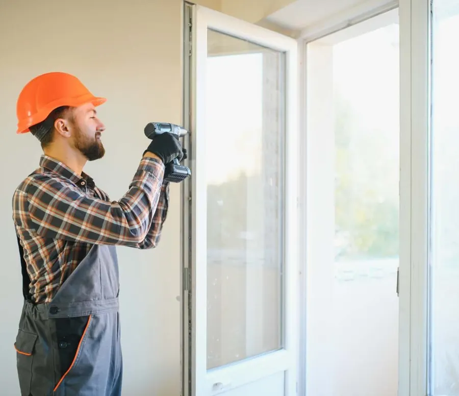 Door repair specialist adjusting a uPVC door